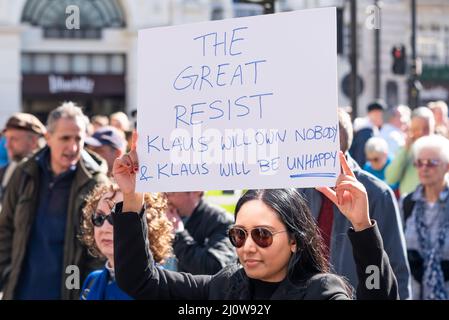 Protest taking place against vaccinating children for Covid 19, joined by anti-vaxxers. Placard referencing the Great Reset and Klaus Schwab Stock Photo