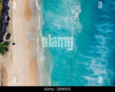 Tropical beach with blue transparent ocean and waves. Aerial view, top view Stock Photo