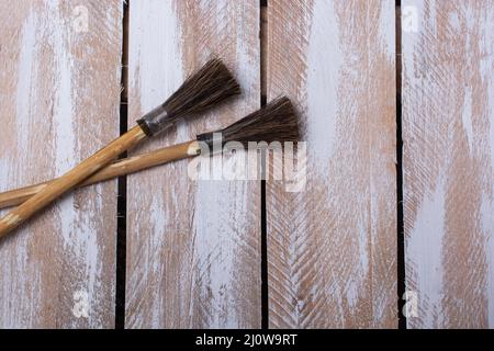 Paint brushes on technique ebru art on wooden background Stock Photo
