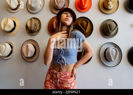Teenage Girl Shopping for Hats in San Francisco Stock Photo