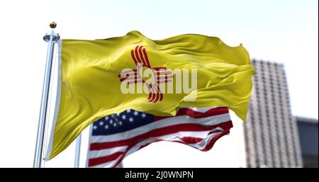 The flag of the US state of New Mexico waving in the wind Stock Photo