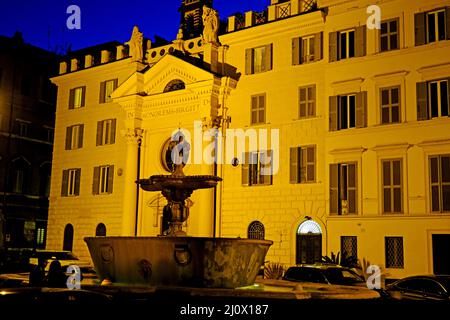 Fontana della Piazza della Piazza Farnese, a decorative fountain in front of Chiesa di Santa Brigida Convent in Piazza Farnese in Rome Italy Stock Photo