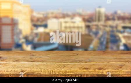 Empty wood table top on a city background in a blur. Mock up for display product Stock Photo