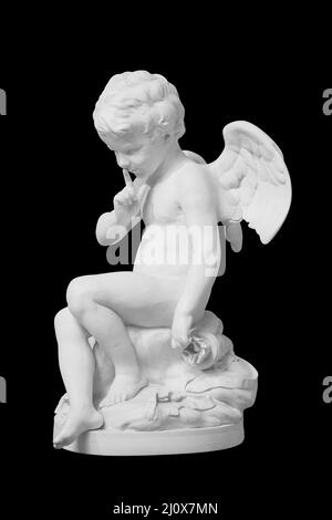 Cupid statue decorated. Angel sculpture on black background with clipping path Stock Photo