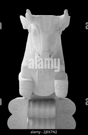 Stone statue. Bull isolated on a black background with clipping path Stock Photo