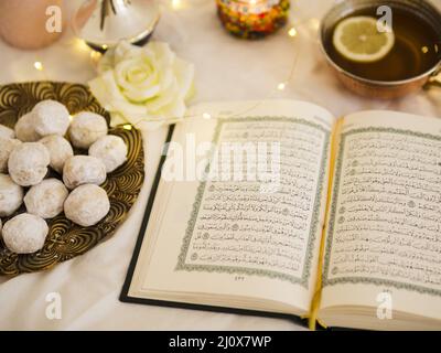 Top view quran with tea pastry. High quality beautiful photo concept Stock Photo