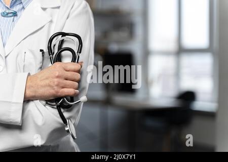 Front view female doctor holding stethoscope with copy space. High quality beautiful photo concept Stock Photo