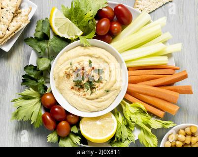 Top view hummus with assortment vegetables Stock Photo