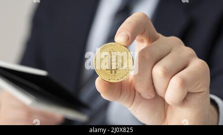 Businessman holding bitcoin close up. High quality beautiful photo concept Stock Photo