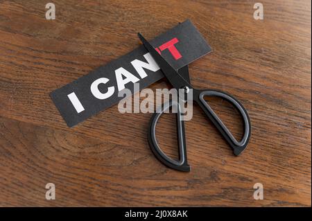 Top view i cant message card being cut with scissor. High quality photo Stock Photo