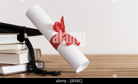 Certificate with ribbon bow books. High quality beautiful photo concept Stock Photo