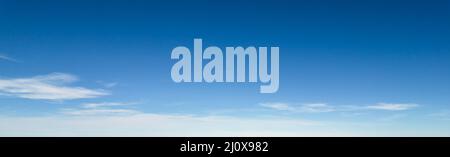 Panorama of blue sky with white foggy clouds Stock Photo