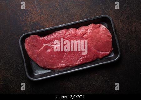 Beef lean raw fillet steak on baking paper with rosemary, garlic and spices  Stock Photo - Alamy