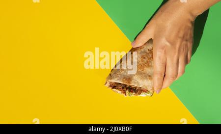 Yellow copy space background delicious mexican taco Stock Photo