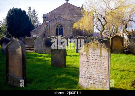 Gravestones in the churchyard of the Parish Church of St Peter and St Paul in Stokesley North Yorkshire England Stock Photo