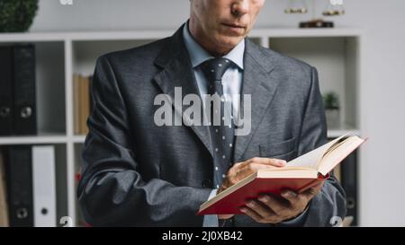 Close up lawyer reading book courtroom Stock Photo