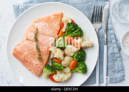 Steam salmon and vegetables, Paleo, keto, fodmap, dash diet. Mediterranean food with fish Stock Photo