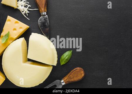 Flat lay cheese assortment ustensils with copy space. High quality beautiful photo concept Stock Photo