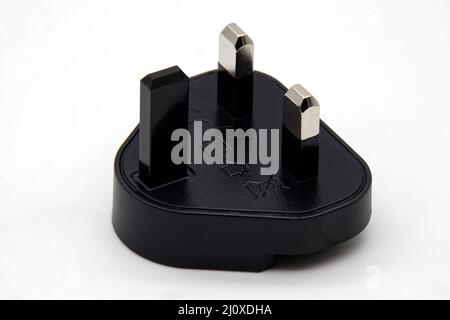 UK plug adapter, isolated on white background Stock Photo