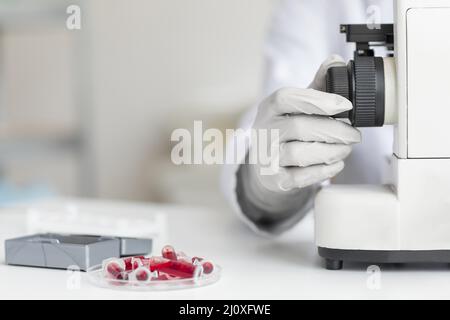 Close up hand using microscope. High quality beautiful photo concept Stock Photo