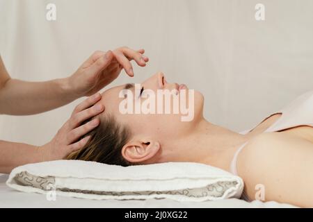 Close up therapist massaging patient s head Stock Photo