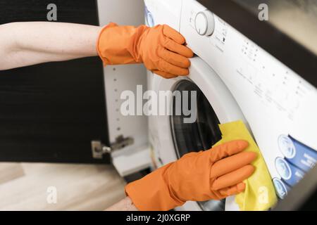 High angle woman cleaning washing machine. High quality photo Stock Photo