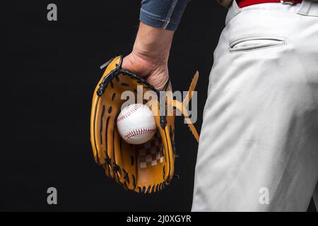Back view man holding glove with baseball. High quality beautiful photo concept Stock Photo