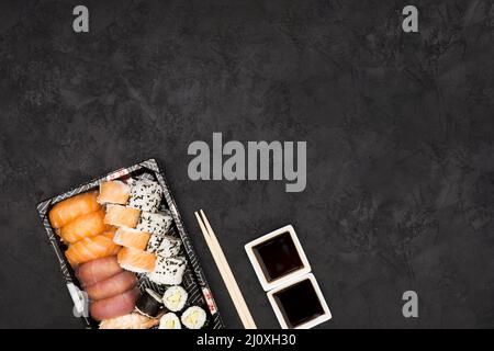Close up sashimi sushi plate with soya sauce black surface. High quality beautiful photo concept Stock Photo