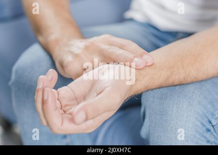 Close up man s hand checking pulse. High quality beautiful photo concept Stock Photo