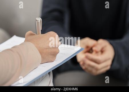 Mid shot woman therapist taking notes clipboard. High quality beautiful photo concept Stock Photo