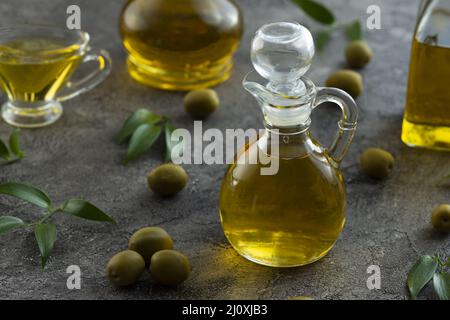 High view of bottles filled with olive oil on marble background Picture on pik. High quality beautiful photo concept Stock Photo