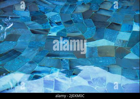 Wavy water surface of swimming pool Stock Photo