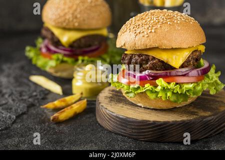 Close up beef burgers cutting board with sauce. High quality beautiful photo concept Stock Photo