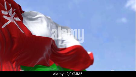 Detail of the national flag of Oman waving in the wind on a clear day Stock Photo