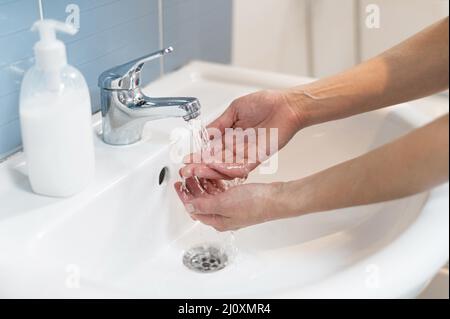 Person washing hands with soap 2. High quality beautiful photo concept Stock Photo