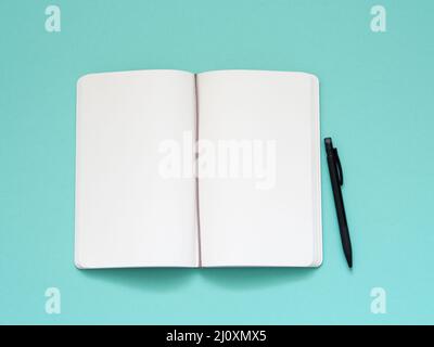 Open notepad with a clean white page Stock Photo