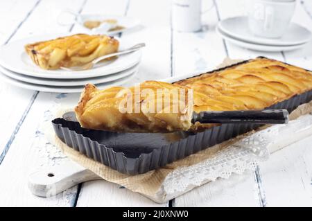 Traditional French quince tart served as close-up in classic backing dish Stock Photo