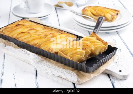 Traditional French quince tart served as close-up in classic backing dish Stock Photo