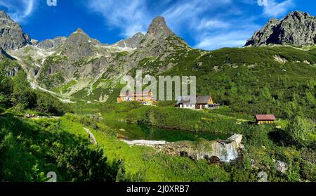 Slovakia landscape. Hut near the Zelene pleso, Vysoke Tatry NP, Europe. Sunny say in the mountains. Rocky hill isn summer season. High Tatras, lake wi Stock Photo