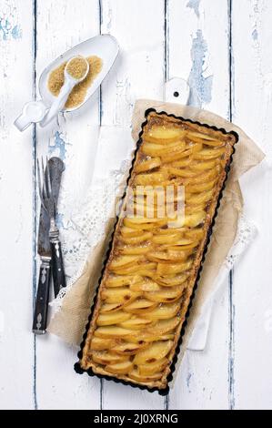 Traditional French quince tart served as top view in classic backing dish Stock Photo