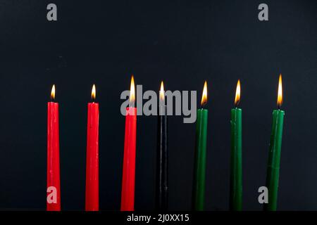 Composition of halloween candles and copy space on black background Stock Photo