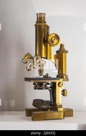 Siena, Italy - 2022, March 10: An antique microscope, in a showcase at the Museum of Natural History “Accademia Fisiocritici”. Stock Photo