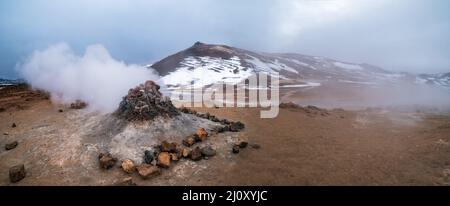 The Namafjall Geothermal Area, Iceland, on the east side of Lake Myvatn. At this area, also known as Hverir, are many smoking fu Stock Photo