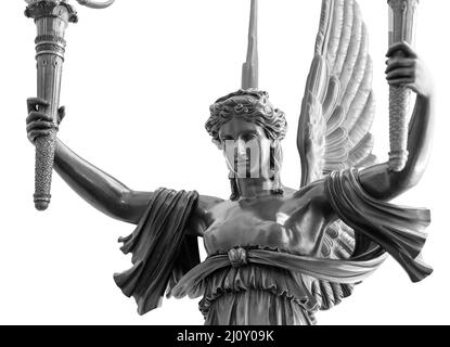 Sculpture of a Winged Victory goddess Nika. Statue of a beautiful holy angel with wings holding a torchs isolated at white backg Stock Photo