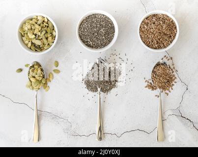 Bowls with various seeds spoons. High quality photo Stock Photo