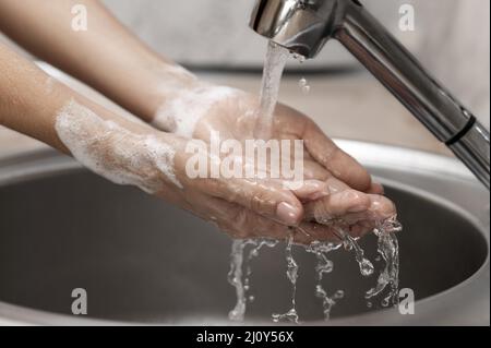 Person washing hands sink. High quality photo Stock Photo