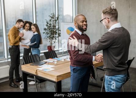 Men handshaking agreement after meeting. High quality photo Stock Photo