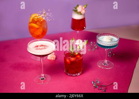 Cocktails with different flavors on a pink background Stock Photo
