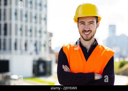 Medium shot portrait construction worker looking camera. High quality photo Stock Photo
