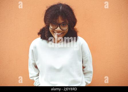African american optical woman with curly hair holding glasses over ...